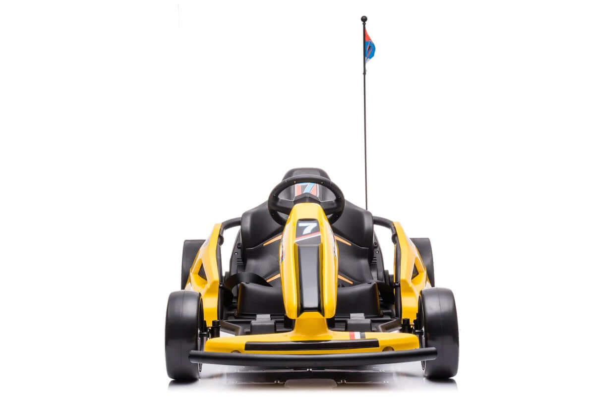 The Yellow 24V Ultra-Violent Big Kids Complete Edition Drifting Go-Kart sports a yellow design with a black seat and number 7 on the front, features EVA-rubber wheels for high-speed drifting, includes four wheels, a steering wheel, and a small flag at the rear, all on a white backdrop.