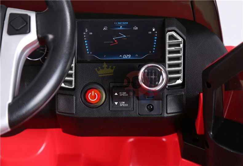 Close-up of the Red 12V Licensed Upgraded Toyota Tundra 1 Seater Kids Ride On Truck with RC dashboard showcasing a digital map, speed indication, and controls beneath. The steering wheel is to the left. Interior features red and black design.