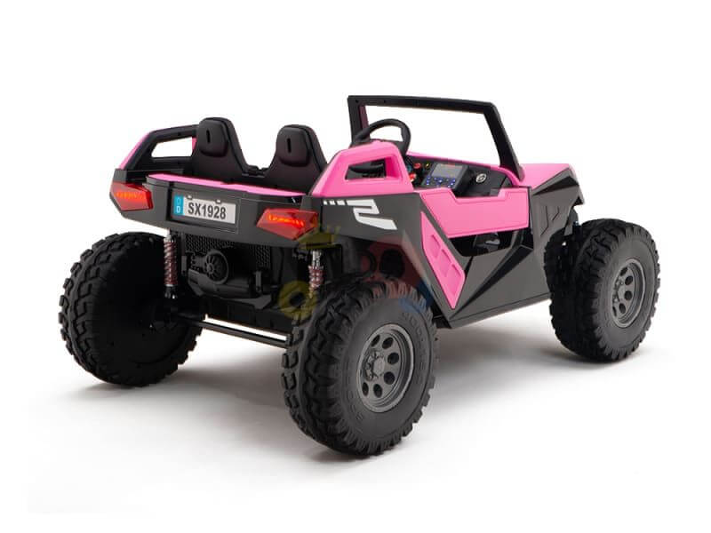 The Pink 24V/4X4 Dune Buggy Ride On UTV features an open two-seat design and rugged rubber wheels, with the sporty license plate SX1928, delivering a thrilling ride.