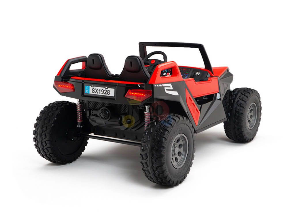 The Red 24V/4X4 Dune Buggy Ride On UTV features rubber wheels, two seats, a detailed dashboard, visible suspension springs, and a rear license plate SK1928. It includes Parental Remote Control for safe adventures.