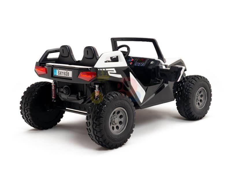 The White 24V/4X4 Dune Buggy Ride On UTV with rubber wheels showcases its rear details and dual seating in the Kids XXL Edition, featuring a roll cage and sleek black and white design against a white background.