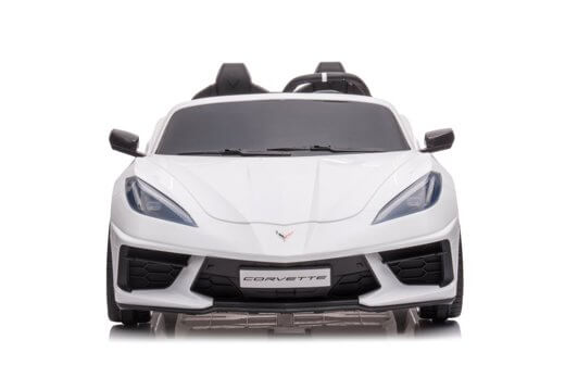 A front view of the Kids Premium 24V White Corvette C8 Dual-Seater toy car, featuring sharp aerodynamic lines, headlights, and distinctive side mirrors with EVA wheels set against a white background.
