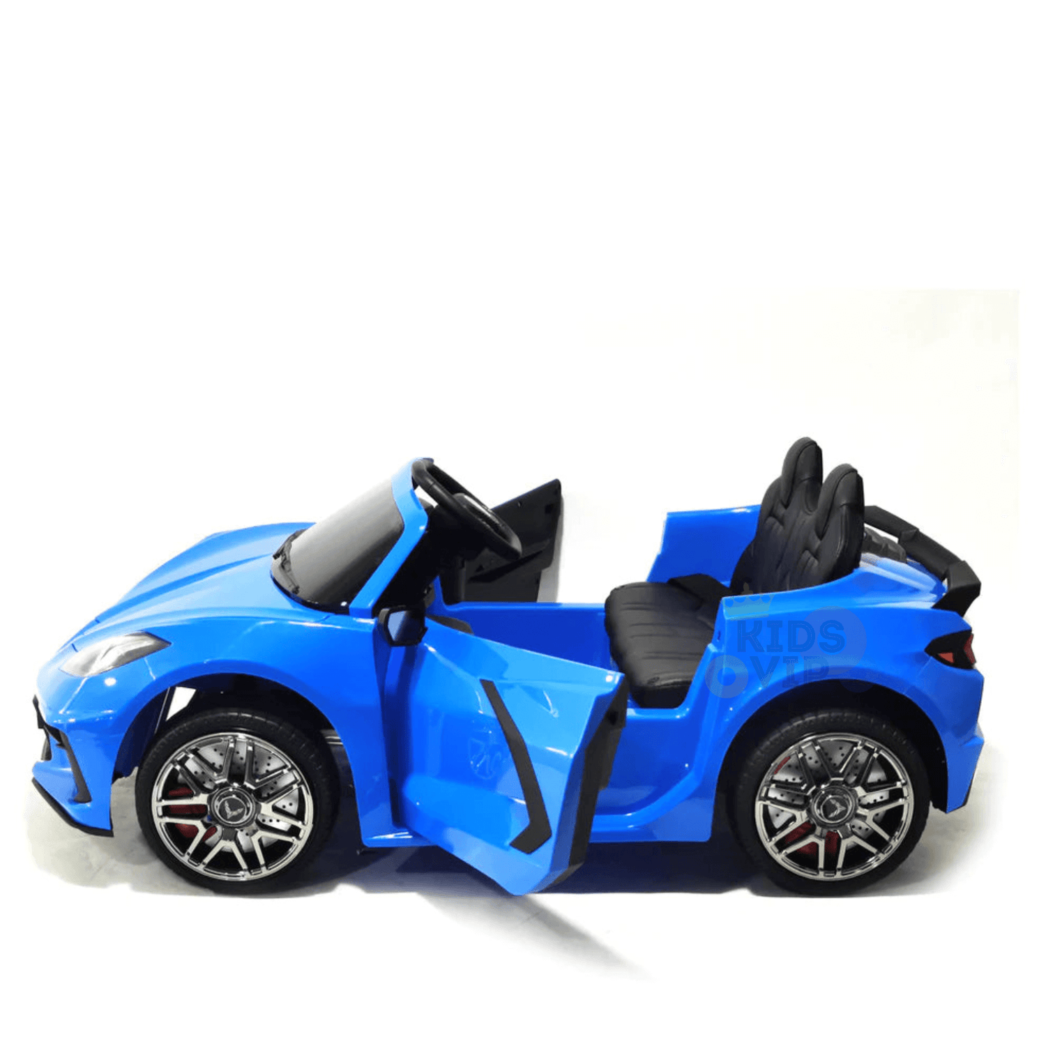 The Kids Premium 24V Blue Corvette C8 Dual-Seater is an exciting sports car replica complete with sleek black leather seats and shiny EVA wheels. Its open doors and small steering wheel make it ideal for young drivers, all set against a plain white background.