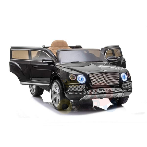 The Black Licensed Bentley Bentayga Complete Edition 12V Kids Ride On Car features open front doors, blue headlights, and silver accents. It boasts a beige leather seat for added style and is set against a plain white backdrop for contrast.