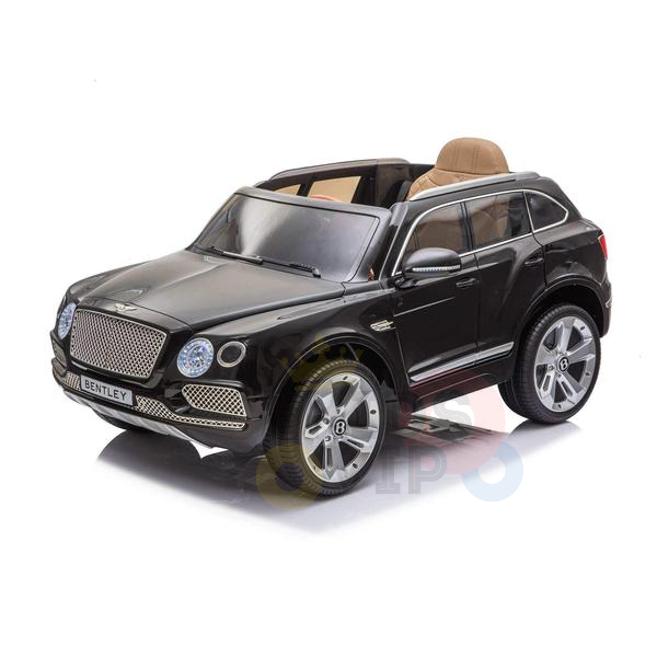 The Black Licensed Bentley Bentayga Complete Edition 12V Kids Ride On Car With RC is a small ride-on car featuring a convertible roof, silver alloy wheels, and luxurious beige leather seats. The front license plate reads BENTLEY, with a parental remote for safe supervision.