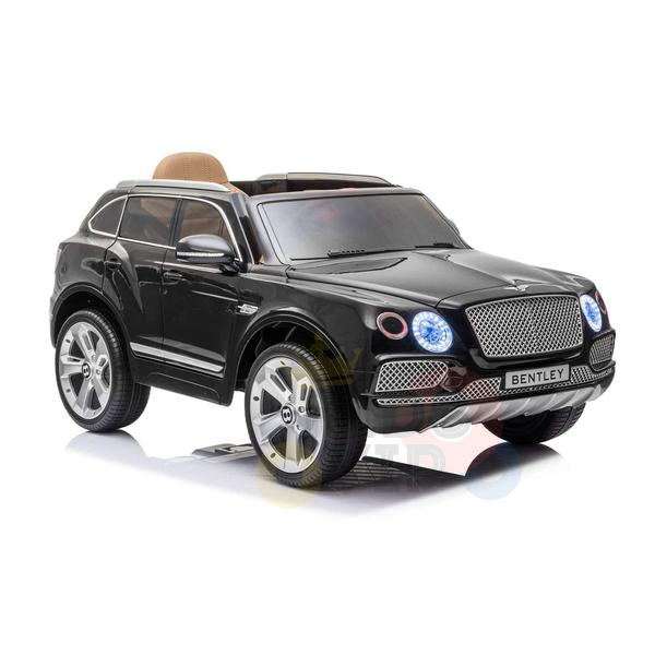 The Black Licensed Bentley Bentayga Complete Edition 12V Kids Ride On Car features chrome wheels, a detailed front grille, and working headlights. It includes a tan leather seat for comfort and a parental remote for safety and control.
