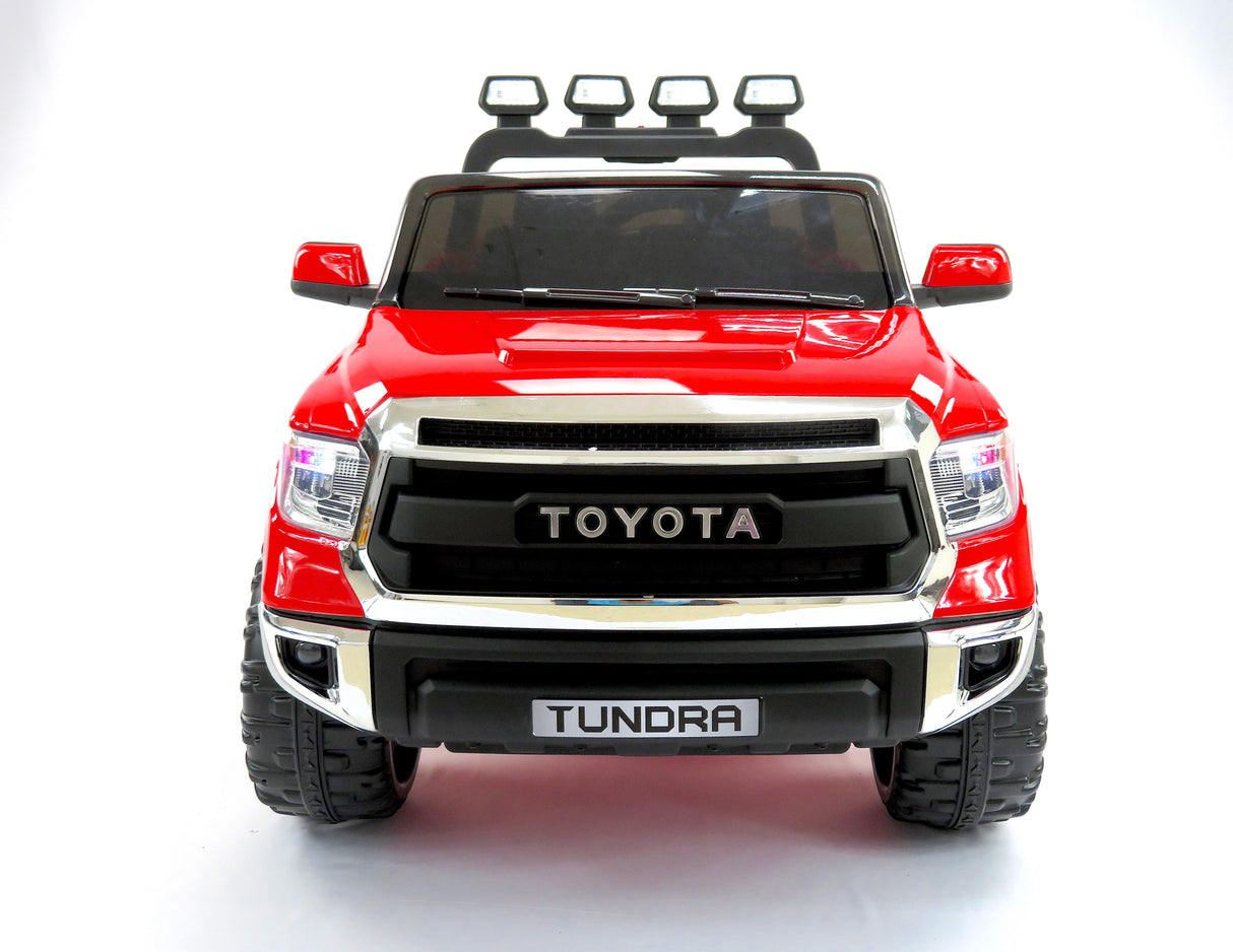 This red 12v licensed Toyota Tundra, 2-seater kids ride-on truck features an upgraded EVA edition with a sleek black grille and TOYOTA insignia. With large tires, side mirrors, and top-mounted lights, it captures the essence of a real truck for little adventurers.