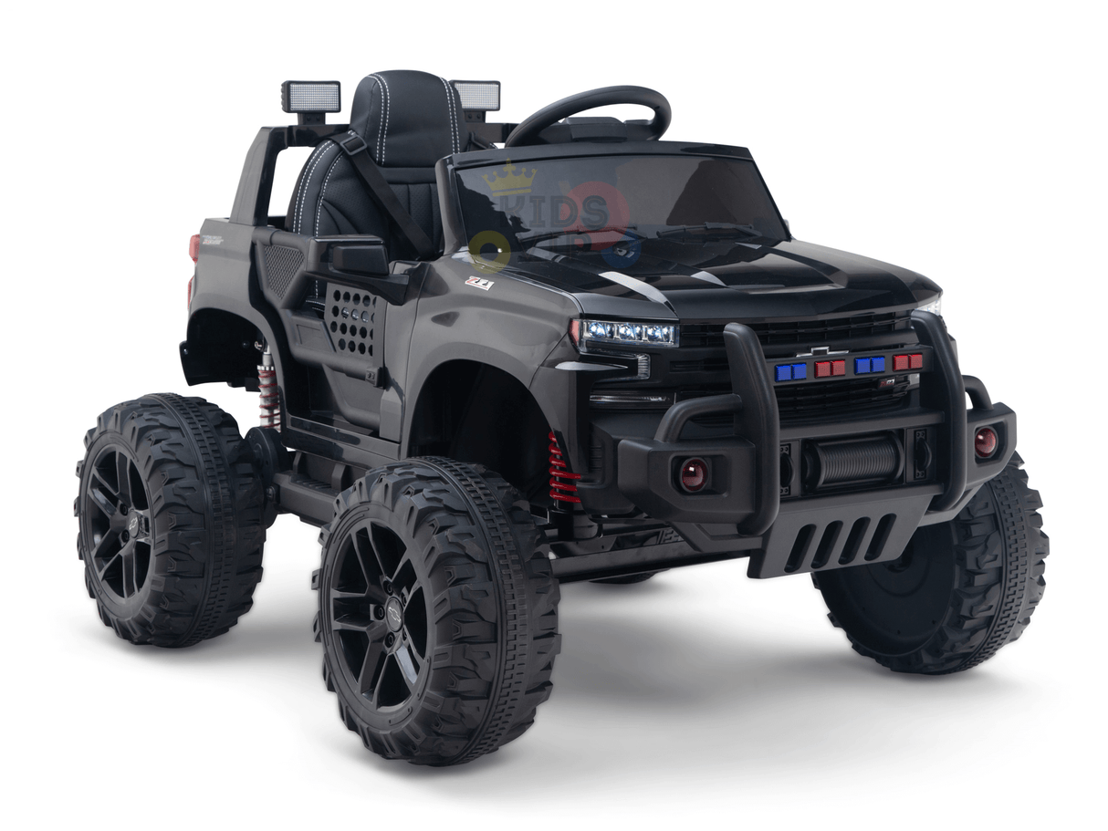 The Black Official 24V Chevrolet Silverado Lifted Kids Ride-on Truck embodies a miniature truck with rugged tires, a detailed grill, LED lights, roll bar, side mirrors, and door seams. This ride-on is powered by a strong 24V battery for endless adventures.