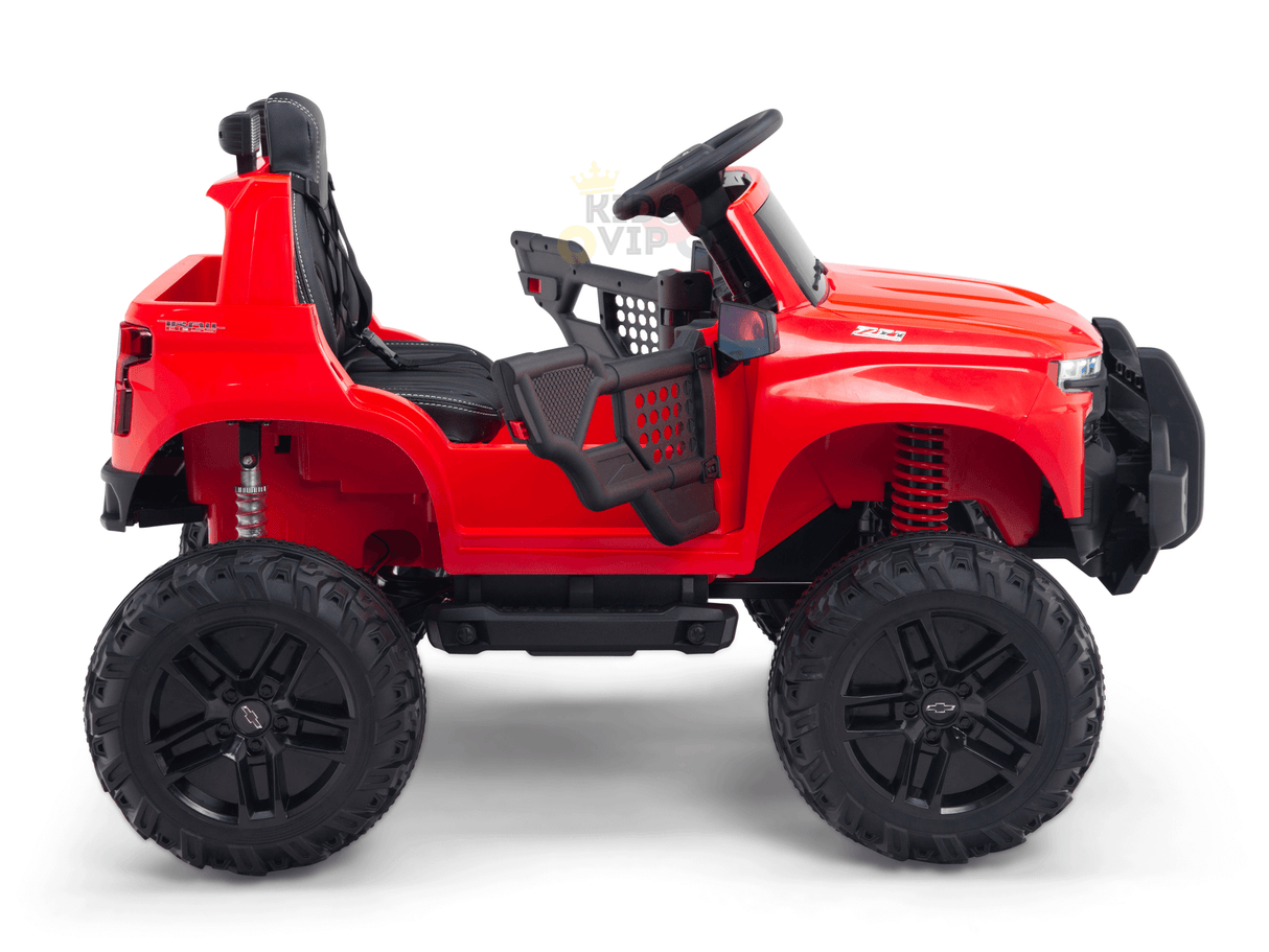 The Red 24V Chevrolet Silverado Kids Licensed Ride On Lifted Truck features a singular seat, remote control, and oversized wheels. This off-road style ride includes suspension springs and rugged design elements that mimic the iconic Chevrolet Silverado, making it perfect for adventurous young drivers.