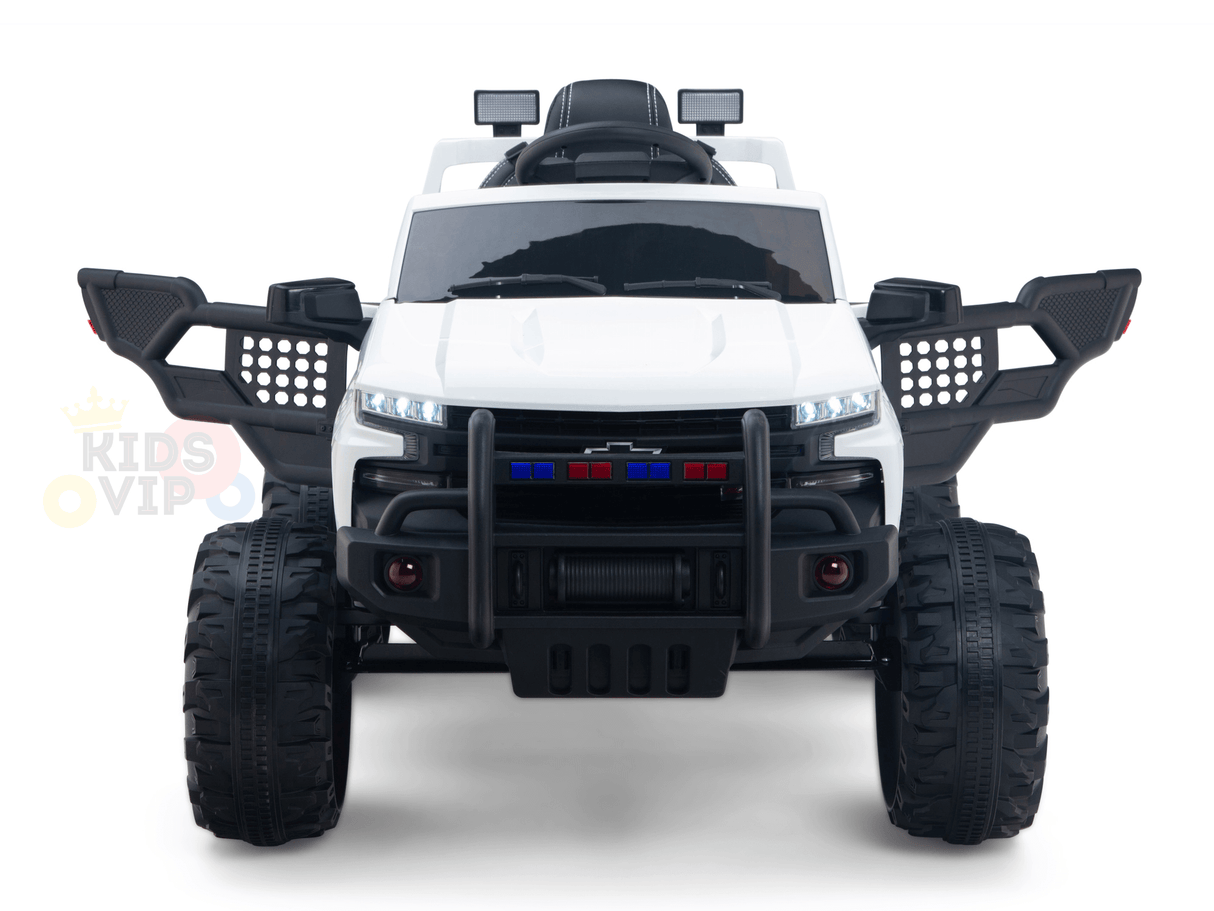 The White 24V Chevrolet Silverado Kids Licensed 1 Seater Ride On Lifted Truck combines a sleek design, oversized black wheels, side mirrors, and a front brush guard with blue and red lights for an adventurous look.