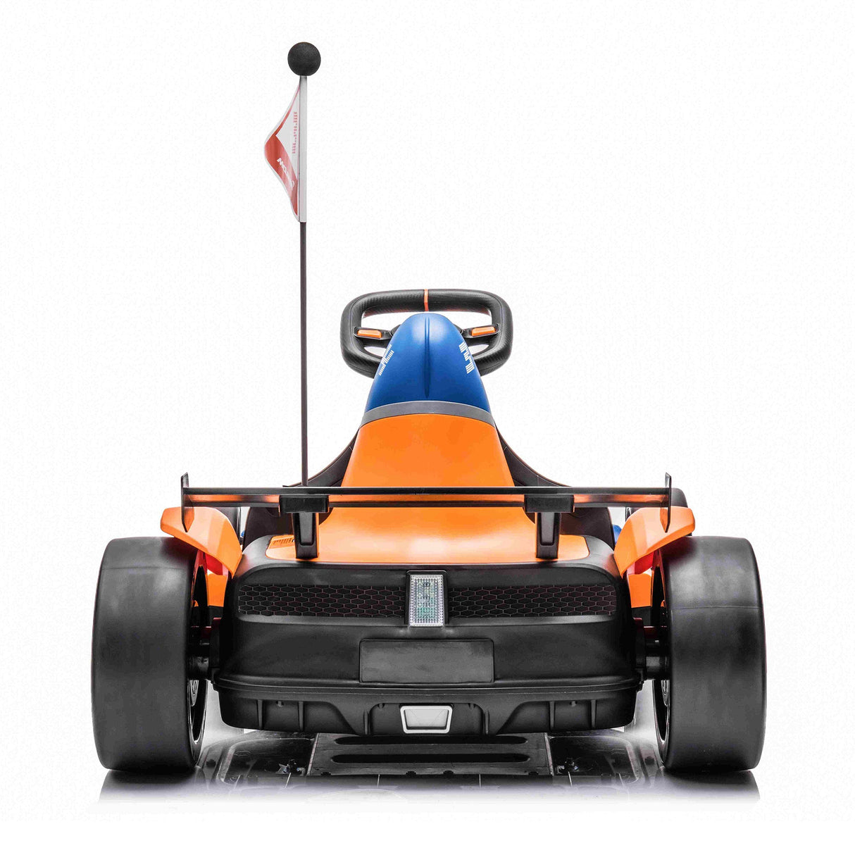 Rear view of the Orange 24V Official Complete Edition McLaren Super Drifting Go-Kart with orange and blue bodywork, large black tires, a visible steering wheel, and a tall flagpole. Perfect for kids ride-on adventures, the white background highlights its sleek design.