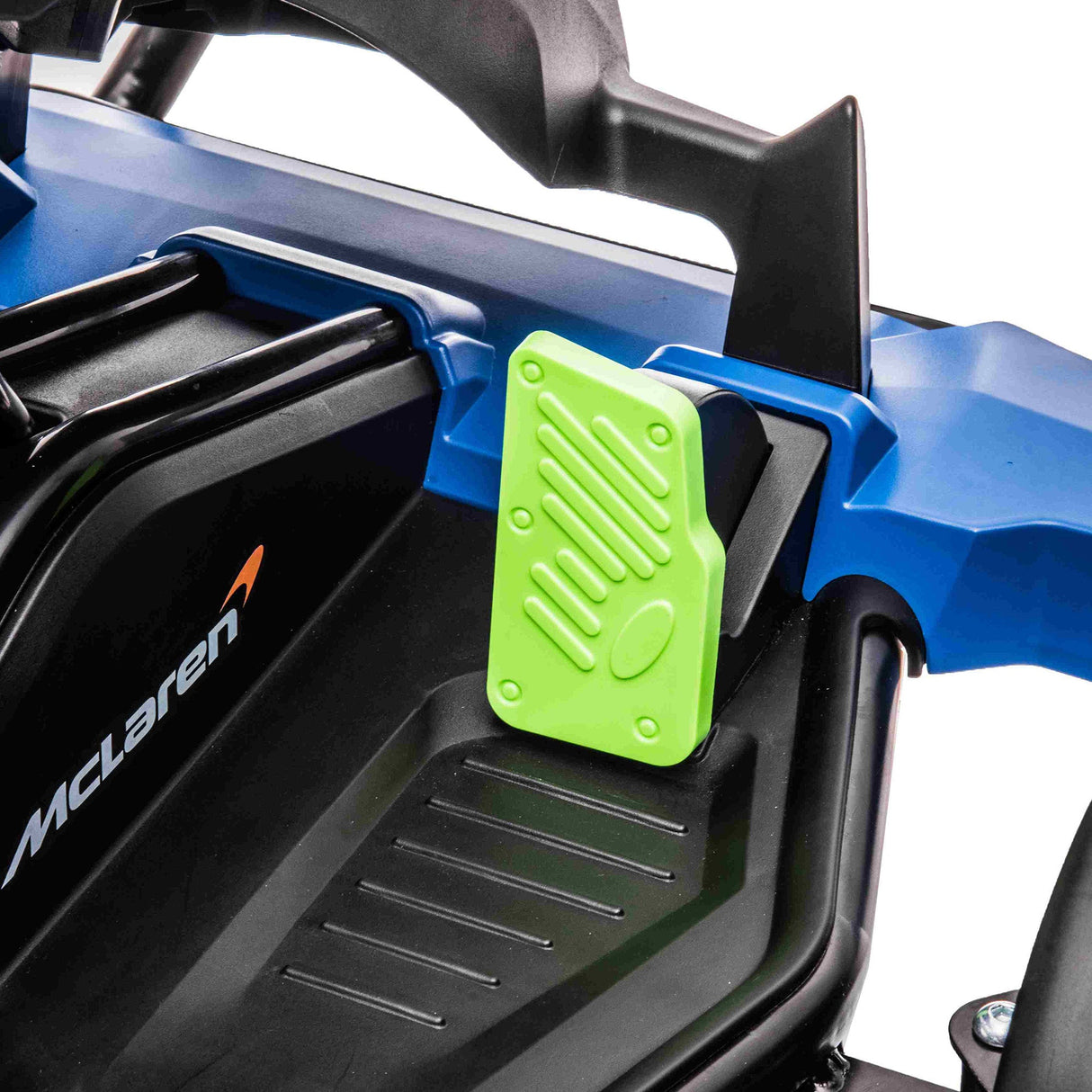 Close-up of the Orange 24V Official Complete Edition McLaren Super Drifting Go-Kart. McLaren is displayed on the black surface, and the textured green pedal ensures a thrilling drift experience for kids.