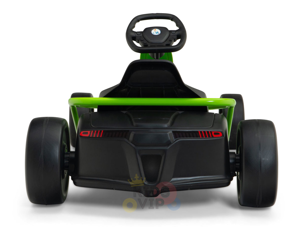 The Green 24v Sport Challenger Outdoor Drifting Kids Go Kart is visible from the rear, showcasing a vibrant green frame, large black wheels, and red design elements. The steering wheel sits above its low seat.