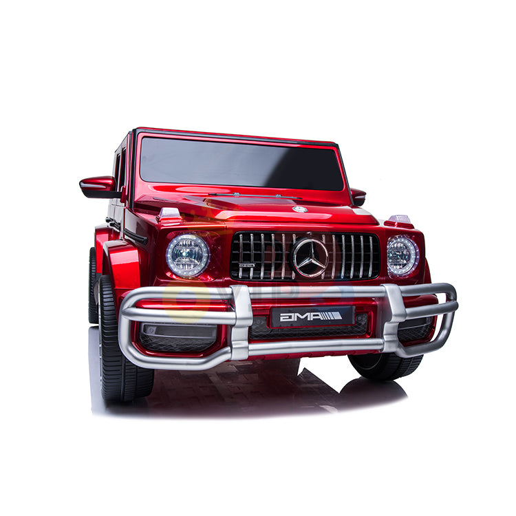 Introducing the 2 Seats 4x4 Official Mercedes Benz G63 Complete Edition Kids Ride-On Car. This shiny red model features a prominent grille, round headlights, chunky tires, brand emblem, and chrome bumper accents, all powered by a 24V battery for an authentic driving experience.