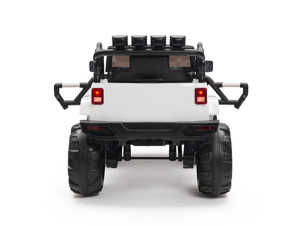 The rear view of the White 12V Sport Edition Trailcat Big Wheels Kids Ride on Truck with RC showcases trailcat big wheels, roof-mounted spotlights, black roll bars, a spare tire, and glowing red taillights against a white backdrop—ideal for kids dreaming of off-road adventure.