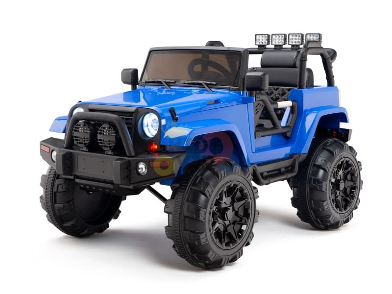 The Blue 12V Sport Edition Trailcat Big Wheels Kids Ride on Truck with RC is a blue toy Jeep featuring rugged tires, roll cage, mounted lights, and detailed design elements like a front grille, bumper, and side mirrors—perfect for off-road adventures.