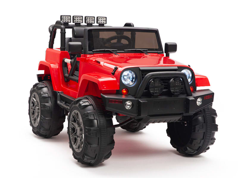 Introducing the Red 12V Sport Edition Trailcat Big Wheels Kids Ride-on Truck with RC, a vibrant toy jeep featuring oversized wheels, roof-mounted off-road lights, and an open cabin. Its detailed front grill and rugged design make it perfect for adventurous play and little explorers ready for any terrain.