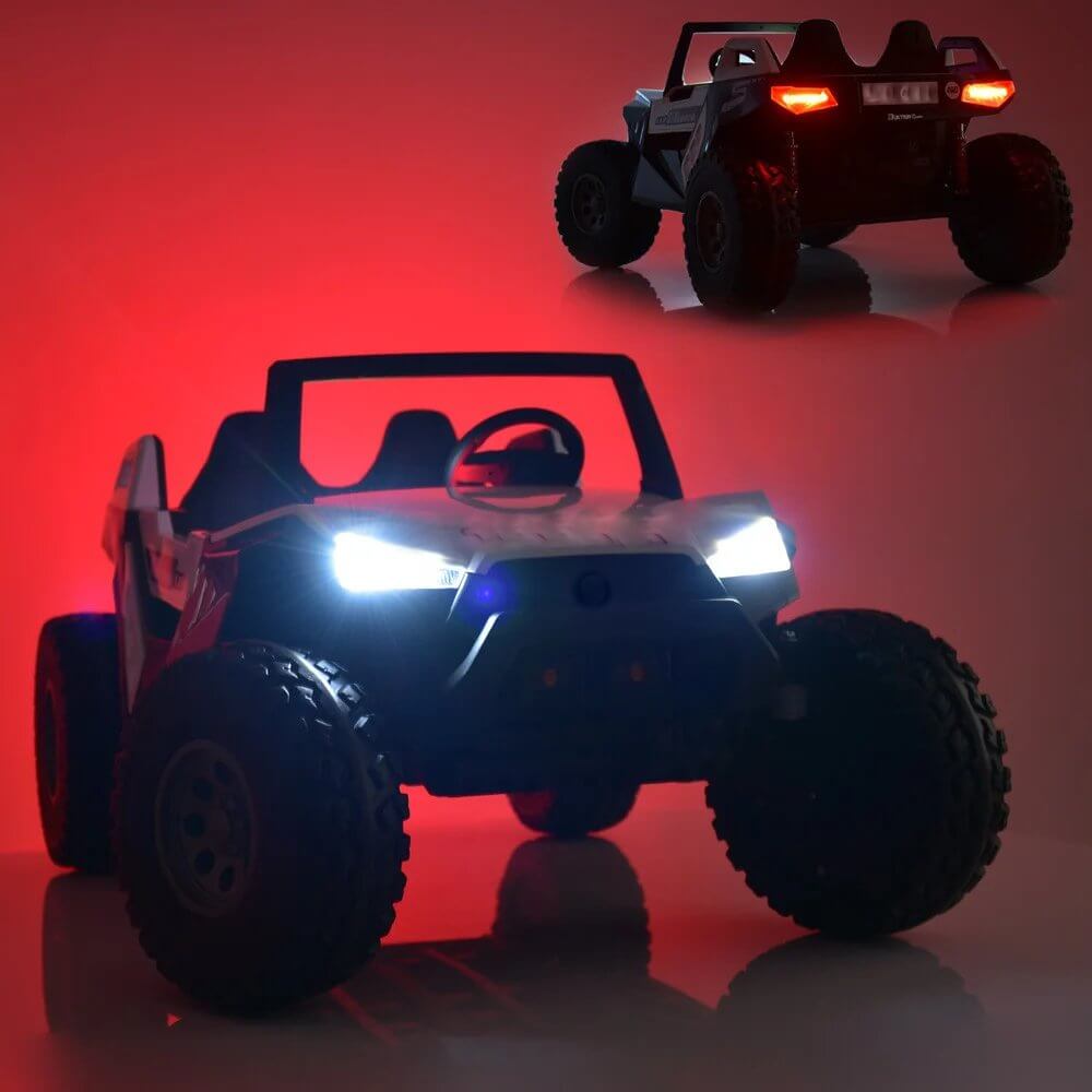 In a dimly lit setting, the Black 24V/4X4 Dune Buggy Ride On UTV is featured with large rubber wheels and glowing headlights. A red hue in the background highlights the kids XXL ride-ons rugged design.