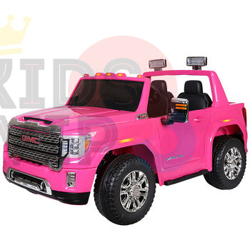 The Pink 2x12V Licensed 4WD GMC Sierra Kids Ride On Car with RC is a kid-sized electric vehicle featuring black seats, detailed grille, side mirrors, roof lights, and large chrome wheels for realistic off-road adventures.