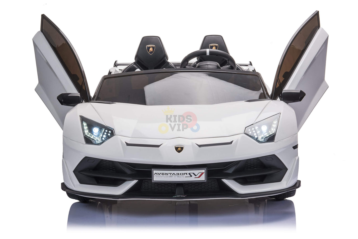 The white 24v Lamborghini SVJ Drifting Kids Ride on Car boasts scissor doors, LED headlights, and detailed front design with Aventador SV on the hood and Kids VIP in the background—perfect for young auto enthusiasts craving luxury.