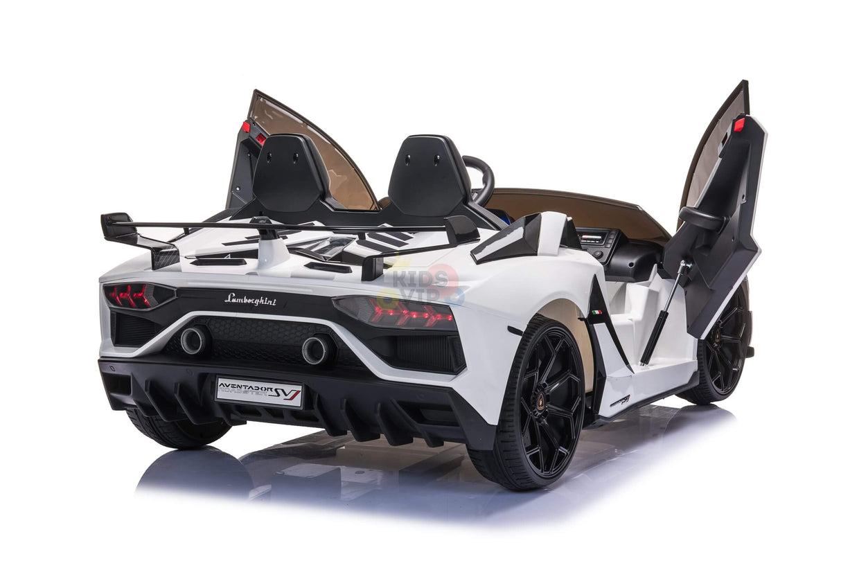 The Upgrade Your Ride with the White 24V Lamborghini SVJ Drifting Kids Ride on Car features a sleek design with butterfly doors, black seats, large drifting wheels, detailed rear lights, and sits on a reflective surface highlighting its sporty look.