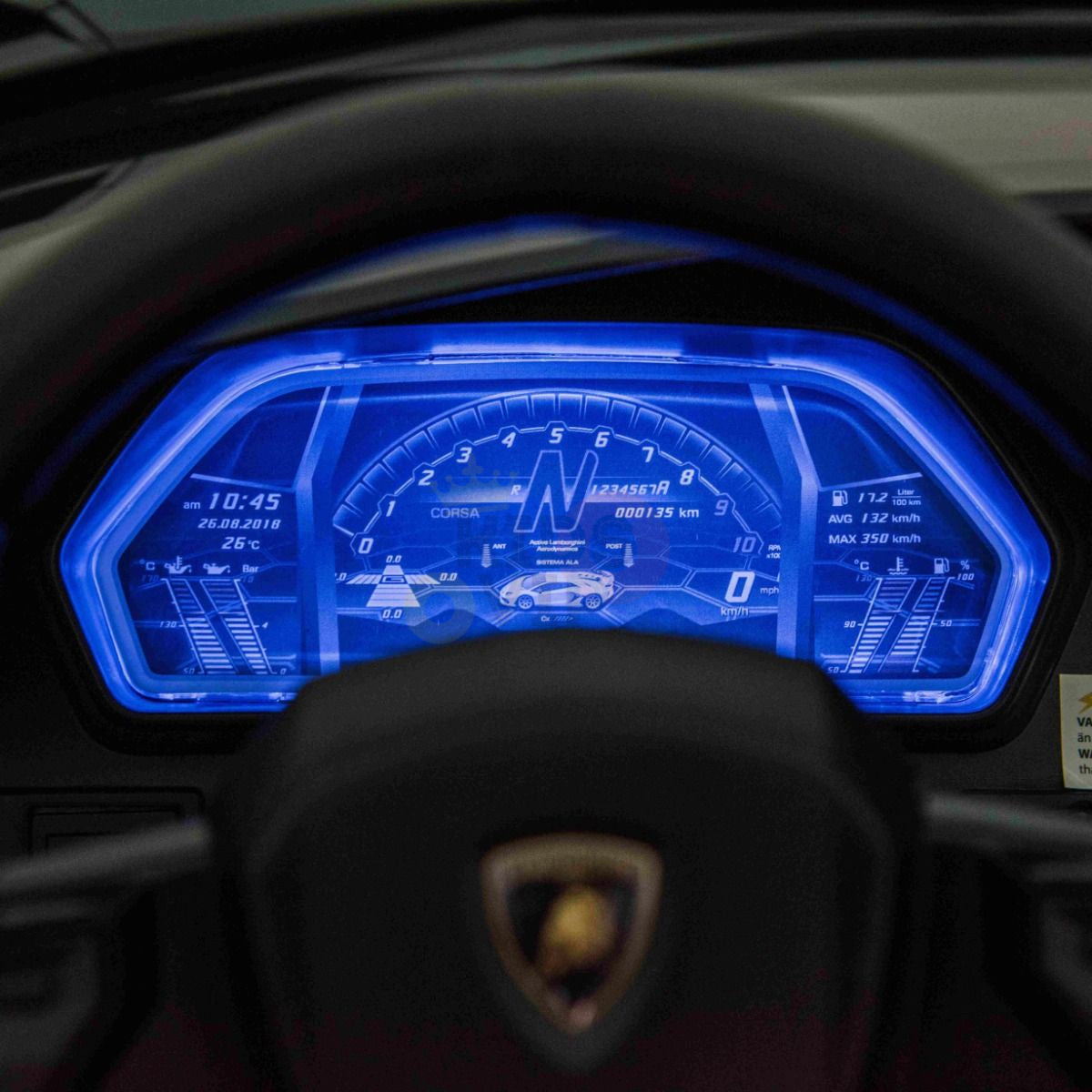 Close-up of a digital dashboard with a blue interface showing 0 km/h. A digital 24V Lamborghini, similar to the Black 24V Lamborghini SVJ Ultimate Drifting Car, is displayed in the center. The time is 10:45, and the odometer reads 713 km.