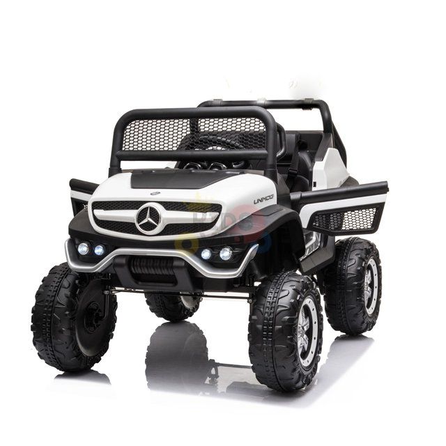 Introducing the White 12V/4X4 Official Mercedes Unimog Junior Ride On UTV, a remote-controlled vehicle for kids resembling an off-road Mercedes-Benz with a black and white body, oversized tires, signature grille logo, two seats, and an easy-to-steer wheel for adventurous young drivers.