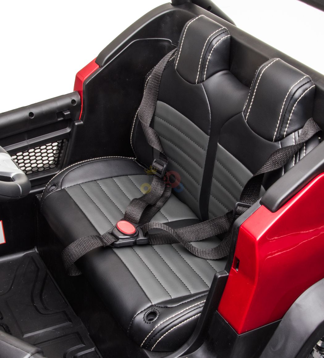 The black Official 12V Mercedes Unimog Junior 4X4 Kids Ride On UTV with Remote Control features a leather-like seat and seat belts, providing an exciting ride-on experience for kids.