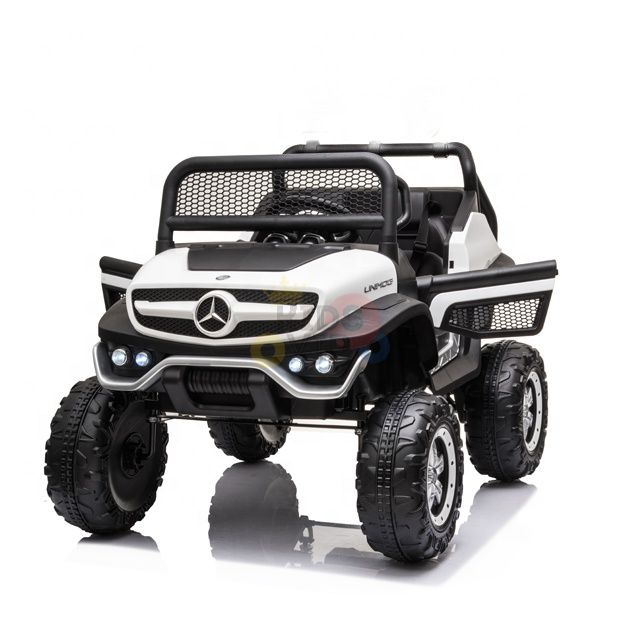 The White 12V/4X4 Official Mercedes Unimog Junior Ride On UTV features large off-road wheels, a prominent front grille with logo, and side mirrors. It offers a sturdy ride for young adventurers, and parents can steer the fun using the optional remote control.