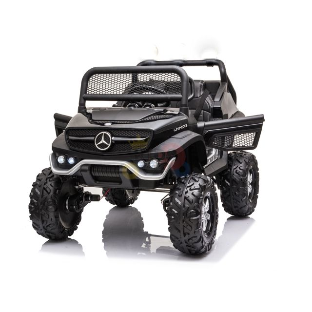 The Black Official 12V Mercedes Unimog Junior 4X4 Kids Ride On UTV features large off-road tires, a protective front grille, realistic front lights, and branding. This luxury kids SUV is powered by a 12V battery and showcased on a white background.