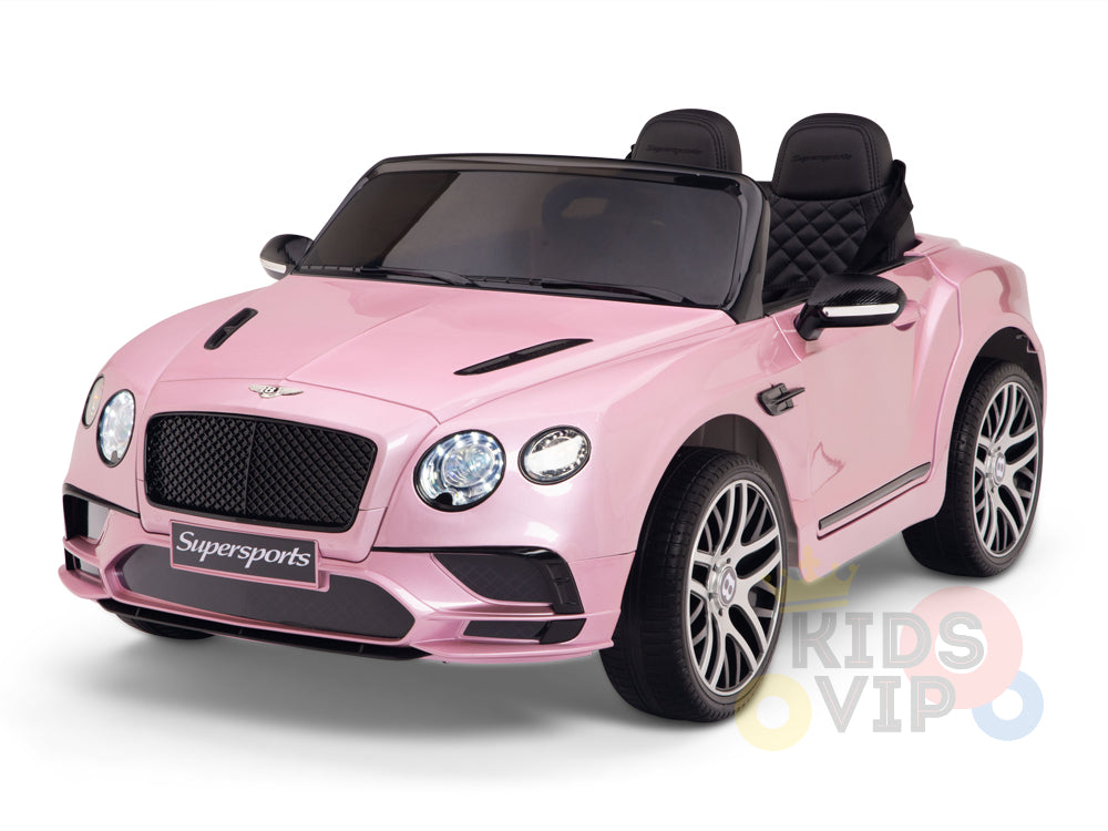 The Pink 12V Bentley GTC Kids Licensed Ride-On Car features black seats, silver rims, detailed headlights, and a prominent front grille. It resembles a luxury vehicle with Supersports on the bumper and includes rubber wheels and parental remote control for safety. Perfectly crafted for little drivers.