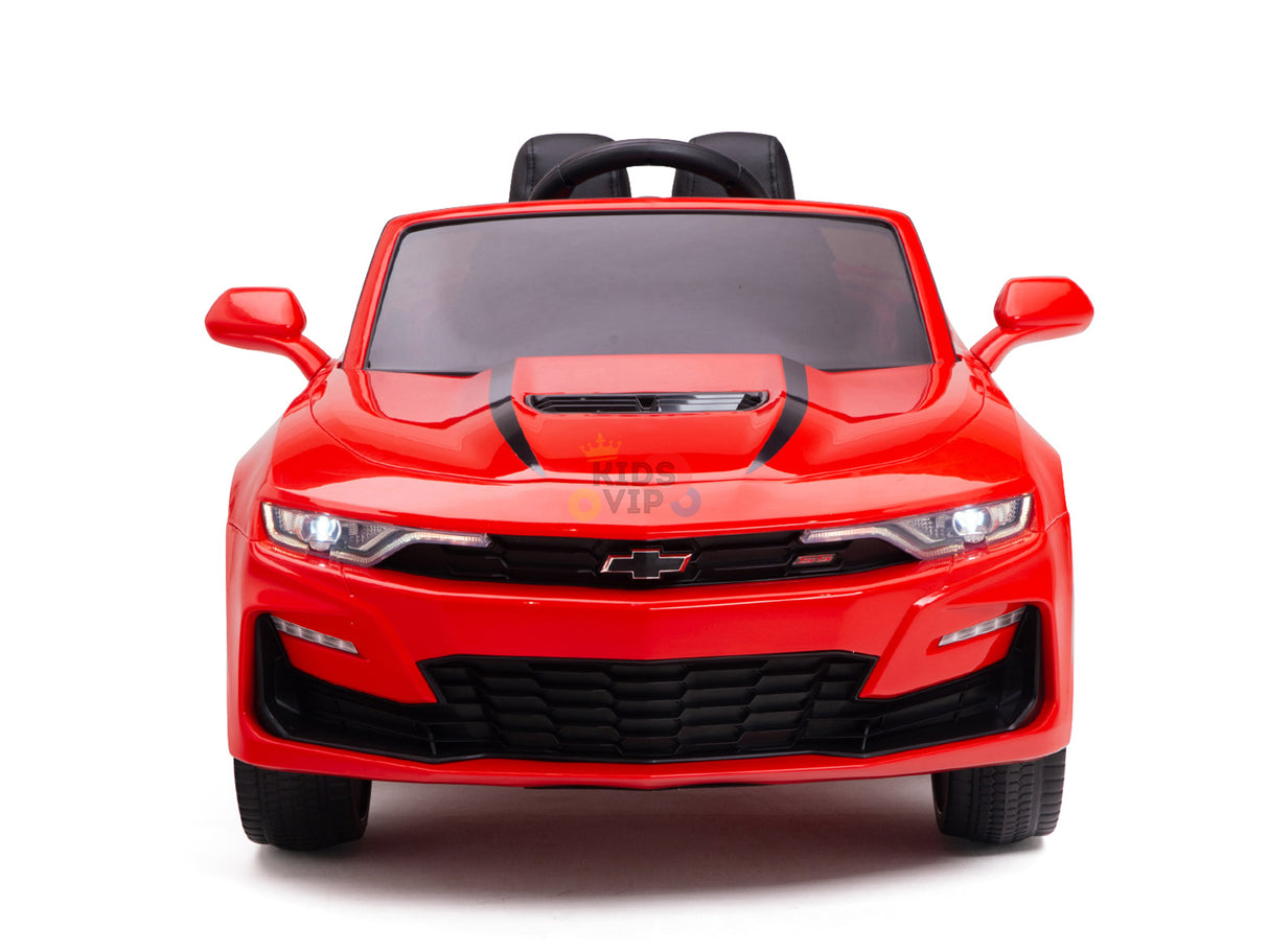 The Red 12V Official Sport Chevrolet Camaro Kids and Toddlers Ride-on Car features a sleek, bright red design with black racing stripes, a low profile, wide grille, side mirrors, and visible headlights. It includes a remote control for enhanced fun.