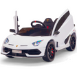The White 12V Lamborghini SVJ Sport Kids Ride On Car boasts vertically opening doors, detailed headlights, sleek styling, and black and red rubber wheels. It features a visible steering wheel and sits against a plain white background.