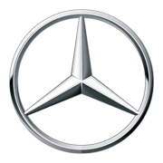 The image shows the Mercedes-Benz logo, a silver three-pointed star enclosed within a circle, symbolizing the brands dominance over land, sea, and air. The design is sleek and metallic, conveying a sense of luxury and elegance.