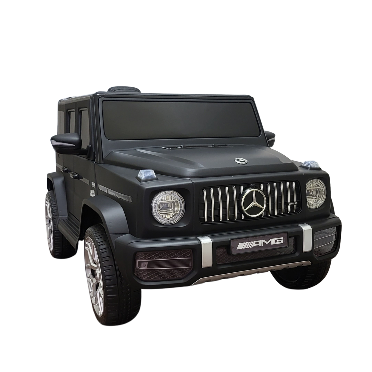 The Limited 12V Matte Edition Mercedes Benz AMG G63 Kids and Toddlers Ride-On Truck features AMG branding, a distinctive grille, detailed headlights, and large wheels. Enhanced tech provides an upgraded play experience, all beautifully showcased on a white background.