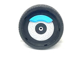 Close-up of a toy car wheel with a black tire and a blue and silver hubcap, featuring Bugatti. The 12v Bugatti Divo Front Wheel accessory stands upright against a plain white background.