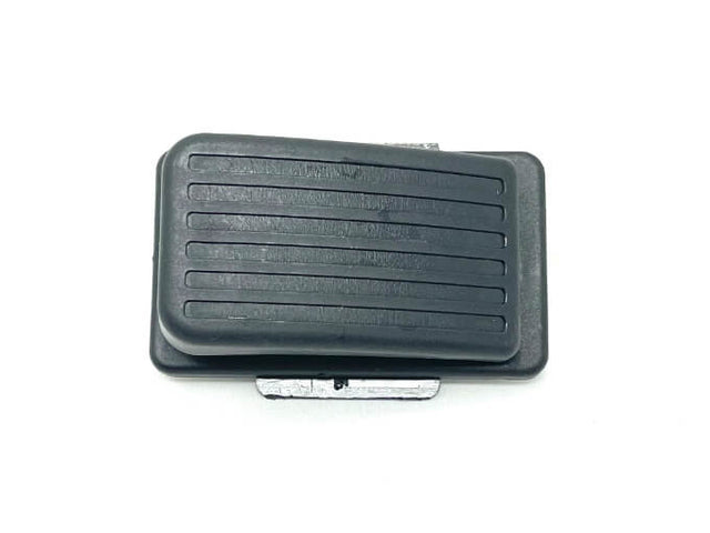 A black rectangular Enhance Your GMC Sierra Experience with a 12v/2 Seater Foot Pedal, featuring horizontal grooves, is set against a white background.