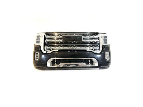 A black and chrome front bumper/grill with a center logo, mesh design, and integrated headlights on each side. Isolated against a white background, its perfect for the 12V/2 Seater GMC Sierra ride-on car enthusiast. Available exclusively as Enhance Your GMC Sierra: 12V/2 Seater Front Bumper/Grill Upgrade.