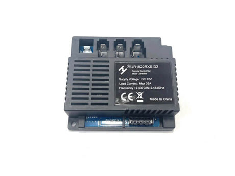 The Enhance Your Ride with a 12V Receiver for 2 Seater GMC Sierra is a black electronic control box suitable for ride-on cars. Specs: DC 12V, max load current 35A, frequency 2.407GHz-2.473GHz, top connection ports. Contact us for inquiries or purchase!.