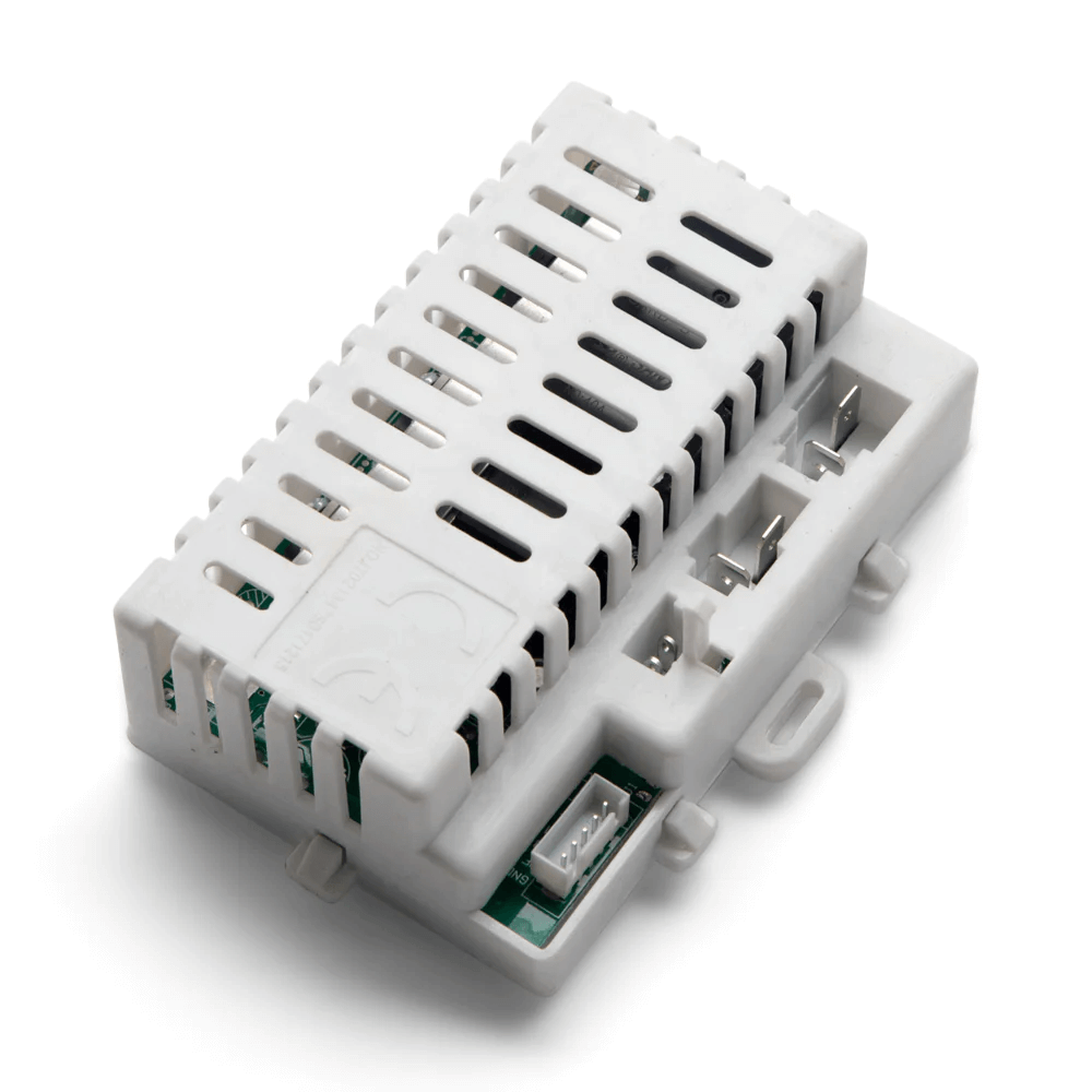 The Enhance Your Range Rover HSE with a High-Quality 12V Receiver is a white plastic electronic component for the Range Rover ride-on car. It has vent-like slots revealing inner circuitry, multiple connectors on one side, a small handle, visible screws, and an embossed manufacturers logo.