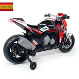 The red and white INJUSA 12V Honda Naked Edition Kids Motorcycle features training wheels, the number 69 on its side, and a Spanish flag labeled Made in Spain in the top left corner.