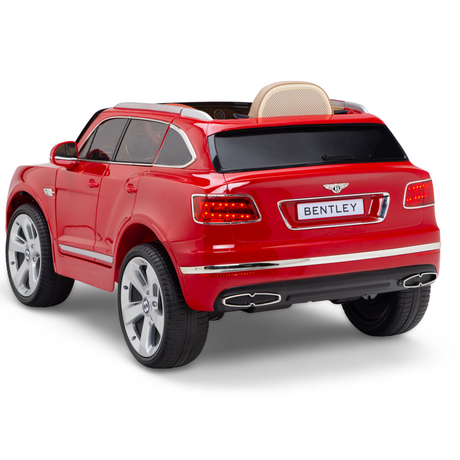 The Red 12V Bentley Bentayga Kids Licensed Ride-On Car features a detailed exterior with silver rims, taillights, a rear license plate, and a comfy leather seat. Displayed against a white background, this glossy toy SUV includes rubber wheels and comes with a remote for enhanced realistic play.