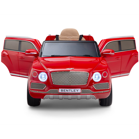 The Red 12V Bentley Bentayga Kids Licensed 1 Seater Ride On Car features open front doors, detailed headlights, a chrome grille, and Bentley branding. Inside, a beige leather seat enhances its luxurious design for children.