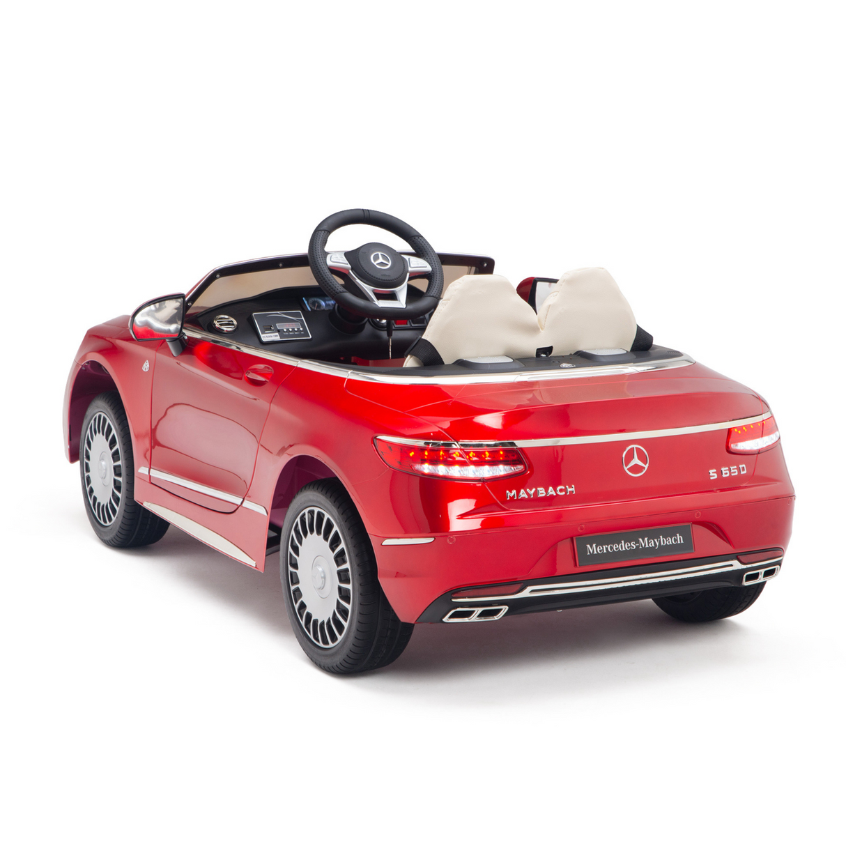 The Red 12V Mercedes Benz Maybach S650 Kids Ride-On Car from KIDS VIP offers a luxurious experience with its detailed interior, black dashboard, and white seats. Its sophistication is enhanced by prominent Mercedes branding.