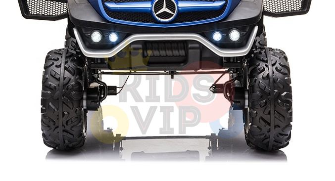 Close-up of a black Kids Ride On Car with rugged tires. The front displays the Mercedes emblem on its blue and black grille, flanked by round headlights. KIDS VIP logo hints at the excitement of the Blue Official 12V Mercedes Unimog Junior 4X4 Kids Ride On UTV with Remote Control experience.