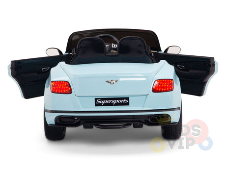 The Blue 12V Bentley GTC Kids Licensed Ride On Car is displayed from the rear with open doors and glowing taillights, featuring the Supersports emblem. Inside, a leather seat and steering wheel are visible, hinting at its remote control capabilities for an exciting ride.
