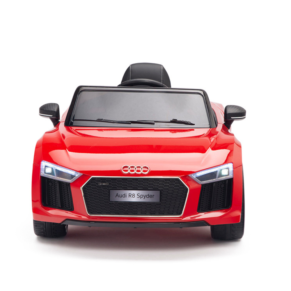 Front view of a Red 12V Audi R8 Licensed 1-Seater Ride On Car with realistic features like headlights, windshield, Audi emblem on the grille, and EVA rubber wheels. It is positioned against a plain white background.