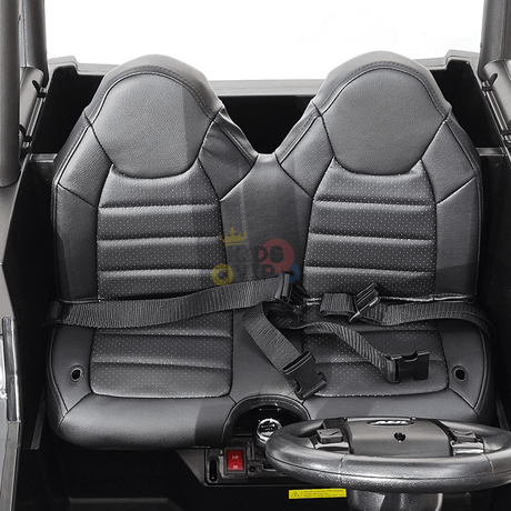 The 2 Seats Golf Buggy 24V Edition Kids Ride On Car UTV with RC features black car seats sporting a textured pattern and seat belts, set in a grey interior. A steering wheel for parental remote control ensures added safety, making it perfect for kids.