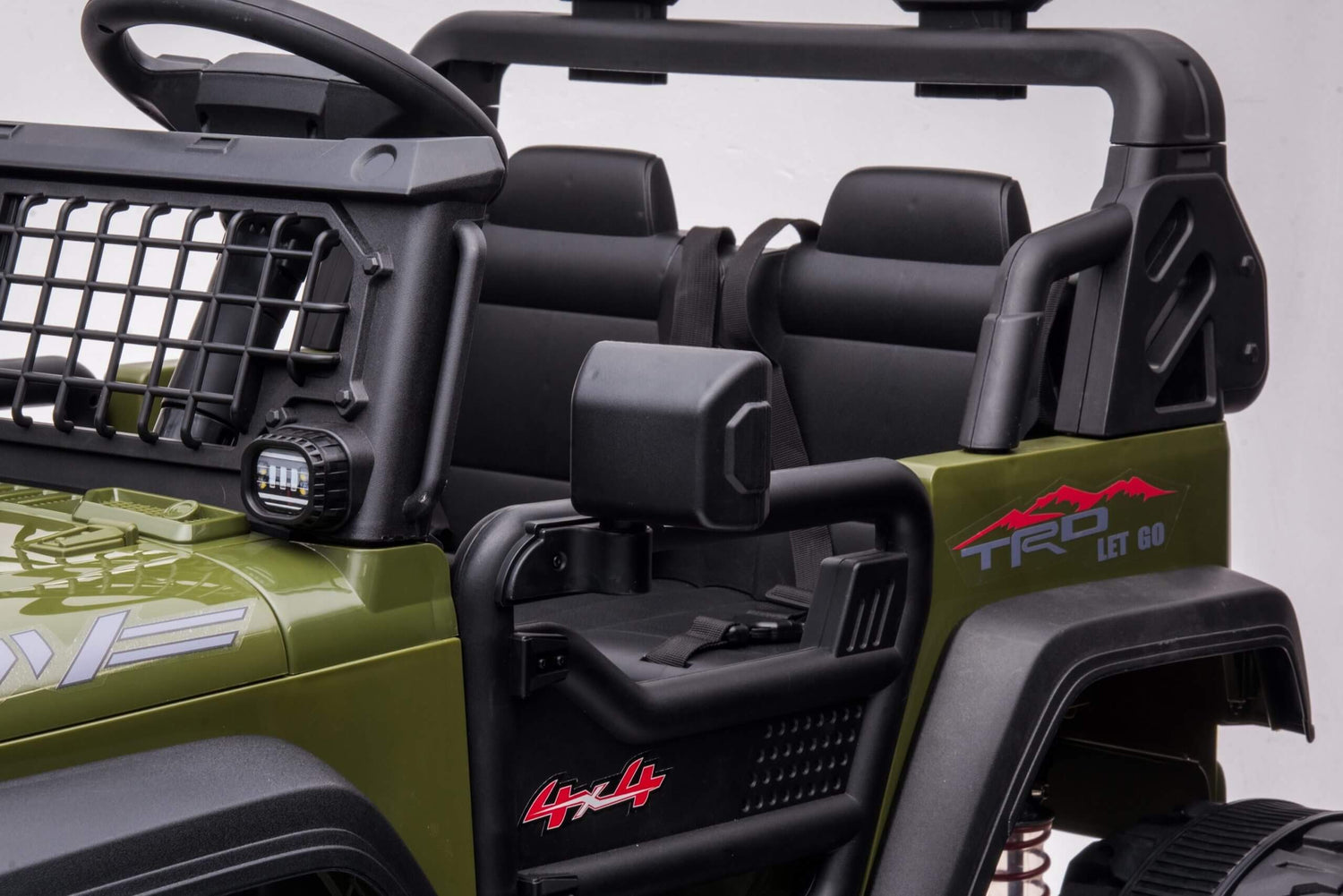The Green 2 Seater 24V Xtreme 2WD Edition Kids Ride on Truck features an olive green body, black interior, off-road design, red graphics, a front grill, side mirrors, and a black roll cage. Its perfect for thrilling escapades with its rugged appearance.