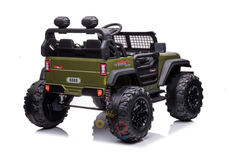 The Green 24V/4WD Xtreme Ride on Truck features large black Eva Wheels, leather seats, a roll cage, side mirrors, and a netted rear window, shown from the rear angle against a white background.